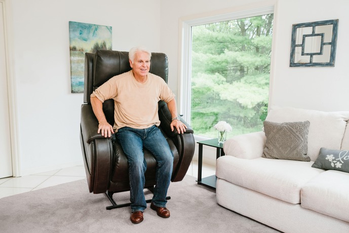 VivaLift! power recliner from America’s #1 Lift Recliner Brand Customer relaxing in a VivaLift! power recliner from America's #1 Lift Recliner Brand, combining style, safety, and therapeutic features for mobility or balance issues